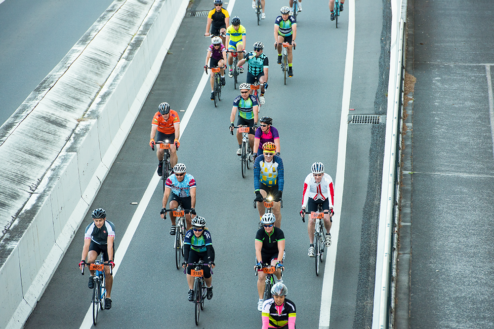 Bike riders on bridge